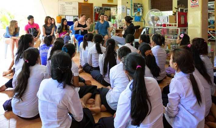 Large class of beauty+ students being taught